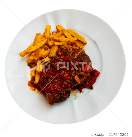 Lunch served on plate - pork chop with vegetable ragout samfain sauce and French fries 117645205