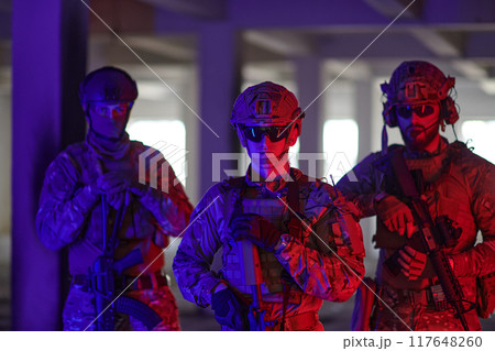 Soldier squad team walking in urban environment colored lightis Soldier squad team walking in urban environment colored lightis 117648260