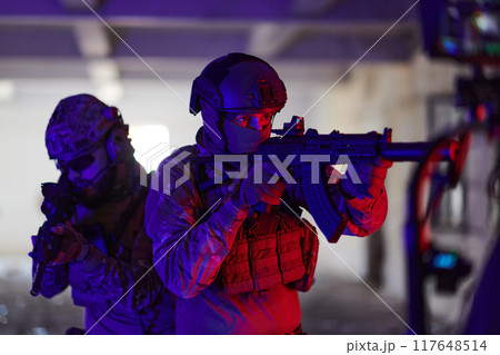 A professional cameraman captures the intense moments as a group of skilled soldiers embarks on a dangerous mission inside an abandoned building, their actions filled with suspense and bravery A professional cameraman captures the intense moments as a group of skilled soldiers embarks on a dangerous mission inside an abandoned building, their actions filled with suspense and bravery 117648514