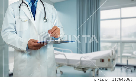 Doctor with stethoscope in white coat holding clipboard standing on the background inside a hospital, Writing medical record diagnosis, Close up, Healthcare and medicine, Concept of treating disease. Doctor with stethoscope in white coat holding clipboard standing on the background inside a hospital, Writing medical record diagnosis, Close up, Healthcare and medicine, Concept of treating disease. 117649369