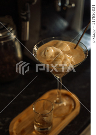 Ice cream with coffee and sugar syrup in a glass 117650831