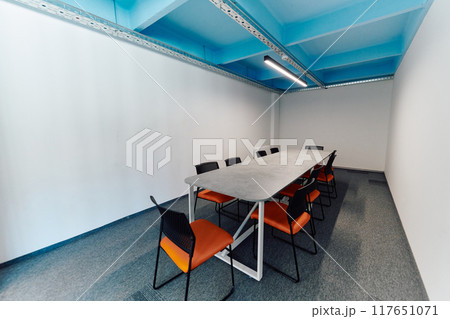 Photo of a modern office where programming, digital marketing and web design projects are done. Office with modern furniture and glass office Photo of a modern office where programming, digital marketing and web design projects are done. Office with modern furniture and glass office 117651071