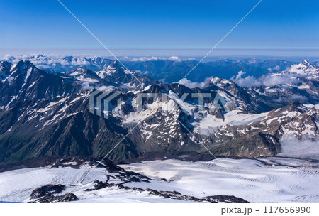 top view of the high mountains above the clouds from the slope of Mount Elbrus top view of the high mountains above the clouds from the slope of Mount Elbrus 117656990
