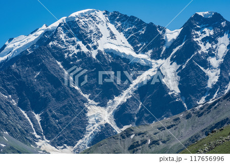 mountain landscape, view of Mount Donguzorun with snowfields and glaciers 117656996