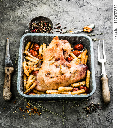 Fried turkey wing with fries in baking tray top view Fried turkey wing with fries in baking tray top view 117657270