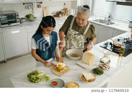 Family Cooking Breakfast In The Kitchen Family Cooking Breakfast In The Kitchen 117660810