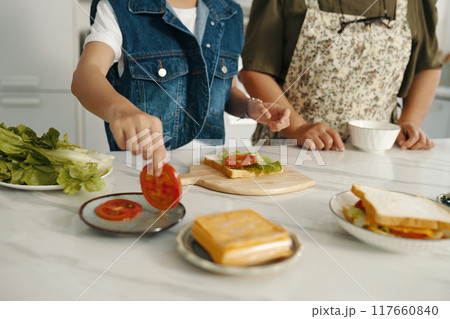 Family Cooking Sandwich Together At Home Family Cooking Sandwich Together At Home 117660840