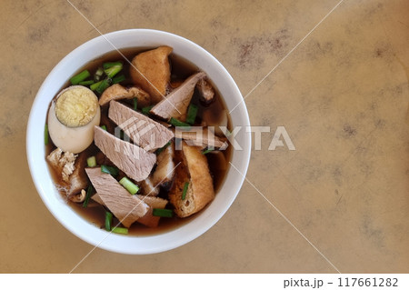 Overhead view on bowl of kueh chap soup which is braised pork meat and organs, popular delicacy among the Chinese in Sarawak 117661282