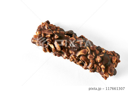 Chocolate wafer bar with caramel and peanuts isolated on white background. Top view with copy space 117661307