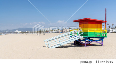 A vibrant photo of a lifeguard tower in the colors of the pride flag 117661945