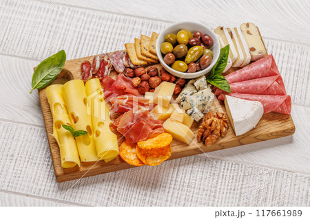 A selection of various cheeses and meats 117661989