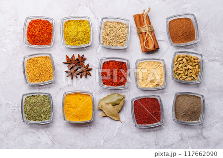 A vibrant assortment of various spices and herbs displayed together A vibrant assortment of various spices and herbs displayed together 117662090