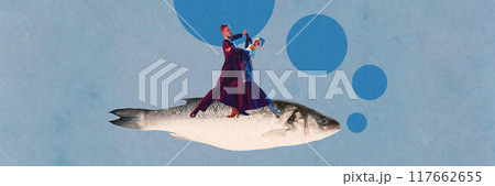 Artistic man and woman, couple gracefully dancing atop large fish, surrounded by blue bubbles, creating whimsical and surreal underwater fantasy scene. Contemporary art collage. 117662655
