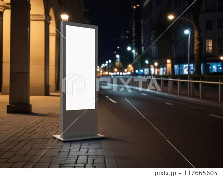 Blank white vertical advertising banner billboard stand on the sidewalk at night. 117665605