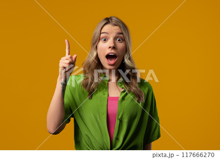 Breakthrough creative idea, 30s aged woman have eureka moment,pointing finger up Breakthrough creative idea, 30s aged woman have eureka moment,pointing finger up 117666270
