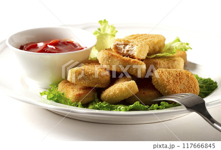 Fried chicken breast nuggets, on lettuce leaves, with tomato sauce, horizontal, no people, selective focus, Fried chicken breast nuggets, on lettuce leaves, with tomato sauce, horizontal, no people, selective focus, 117666845