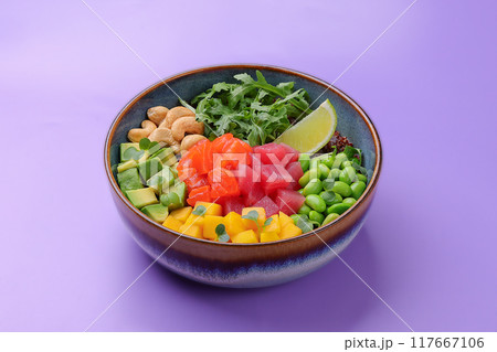Top view of a colorful salmon poke bowl with fresh vegetables and rice, presented Top view of a colorful salmon poke bowl with fresh vegetables and rice, presented 117667106