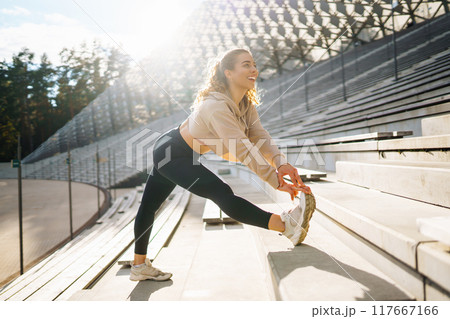 Young woman with smart watch goes in for sports, performs sport exercises. Sport, Active life. Young woman with smart watch goes in for sports, performs sport exercises. Sport, Active life. 117667166