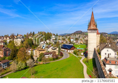 Top view on the old town with Musegg wall and towers in Lucerne city, Switzerland Top view on the old town with Musegg wall and towers in Lucerne city, Switzerland 117668581