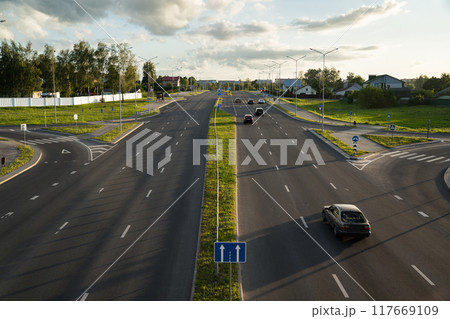 Highway in the evening view from the bridge down. Evening city, motorway Highway in the evening view from the bridge down. Evening city, motorway 117669109
