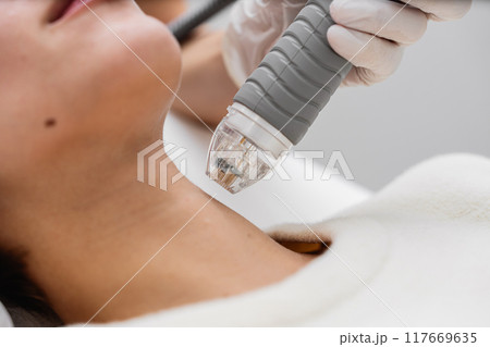 Treatment of women's facial skin in a beauty salon. 117669635