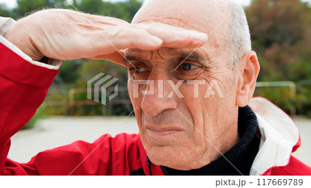 Fisherman Staring At The Sea With Hands To Cover From Sunlight Fisherman Staring At The Sea With Hands To Cover From Sunlight 117669789