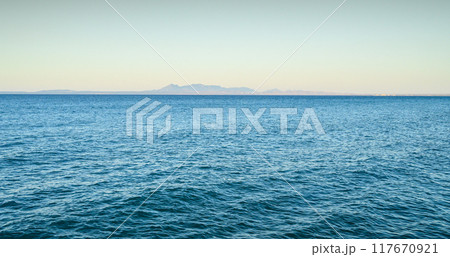 Scenic view of sea against blue sky during summer 117670921