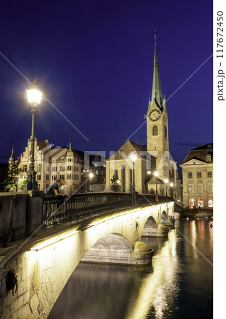 sunset scenic view of historic Zurich city center with famous Fraumunster and river Limmat at Lake Zurich,Switzerland 117672450