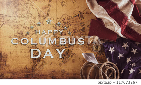 Happy Columbus Day concept. Vintage American flag, compass, paper boat, rope on retro treasure manuscript.  Flat lay, top view with copy space. 117673267