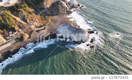 Large rocks natural monument Piedra de Iglecias Church stone on Chilean coast in Constitucion in sunset. 117673431
