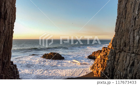 Large rocks natural monument Piedra de Iglecias Church stone on Chilean coast in Constitucion in sunset. Large rocks natural monument Piedra de Iglecias Church stone on Chilean coast in Constitucion in sunset. 117673433