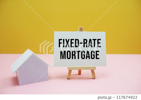 Fixed-rate mortgage text with easel and house model on yellow and pink background, Financial and Property concept 117674922