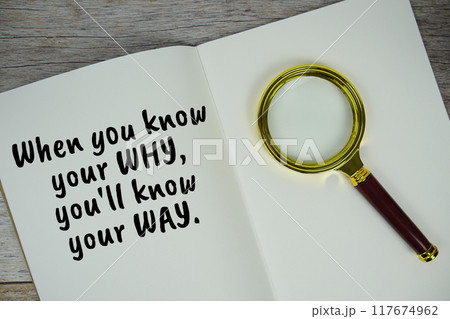 When you know your why, you'll know your way text message written on note page with magnifying glass top view on wooden background When you know your why, you'll know your way text message written on note page with magnifying glass top view on wooden background 117674962