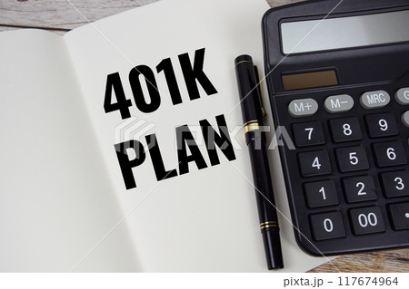 401K Plan text message written on note page with calculator top view on wooden background 117674964