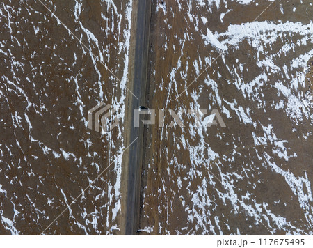 Car running on snowing road in tibet,china 117675495