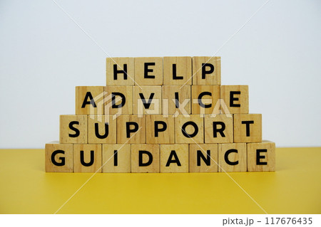 Help, Advice, Support, Guidance with wooden blocks alphabet letterstop view on wooden background 117676435