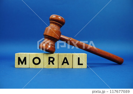Moral alphabet letters with wooden blocks alphabet letters and Gavel on blue background 117677089