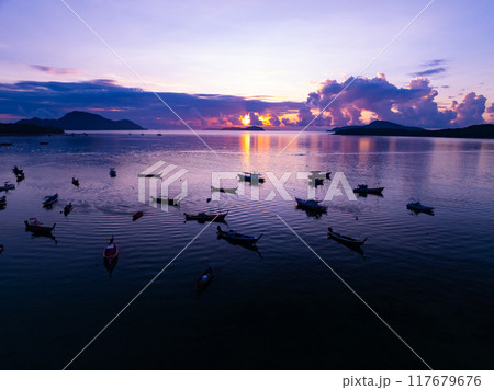 Landscape Aerial view of majestic clouds in the sky sunset or sunrise over sea with reflection in the tropical sea.Beautiful landscape scenery.Amazing light of nature Landscape nature background Landscape Aerial view of majestic clouds in the sky sunset or sunrise over sea with reflection in the tropical sea.Beautiful landscape scenery.Amazing light of nature Landscape nature background 117679676