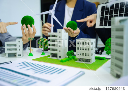 Engineer Teamwork Meeting, with partner on model building at company office working technology, Renewable energy-based green businesses and global warming. Engineer Teamwork Meeting, with partner on model building at company office working technology, Renewable energy-based green businesses and global warming. 117680448