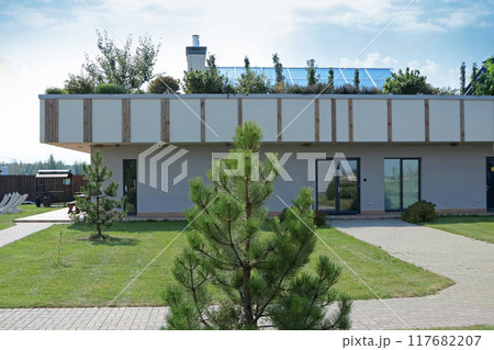 Green garden and plants on roof of house. Technology and protecting planet. Technology and lifestyle. Green garden and plants on roof of house. Technology and protecting planet. Technology and lifestyle. 117682207