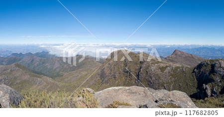Majestic Mountain Peaks Above the Clouds Panorama 117682805