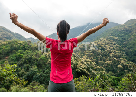 Cheering happy woman feel free on spring morning mountain top Cheering happy woman feel free on spring morning mountain top 117684766