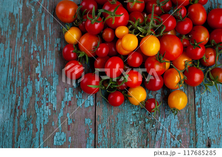 Red and yellow cherry tomatoes top view. Harvest vegetables. Tomato food 117685285