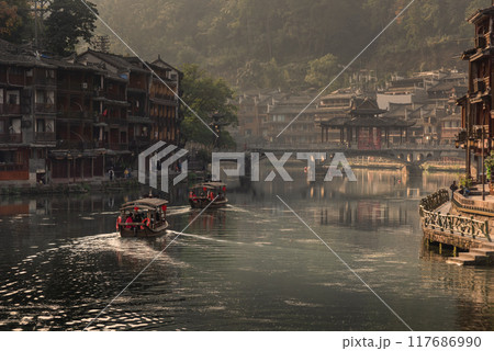 Fenghuang Ancient Town. Located in Fenghuang County. Southwest of HuNan Province, China. Fenghuang is a popular tourist destination of Asia. Fenghuang Ancient Town. Located in Fenghuang County. Southwest of HuNan Province, China. Fenghuang is a popular tourist destination of Asia. 117686990