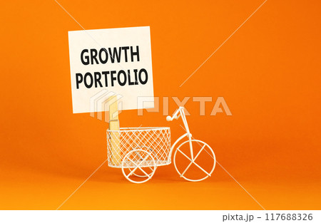 Growth portfolio symbol. Concept words Growth portfolio on beautiful white paper on wooden clothespin. Beautiful orange background. Bike model. Business Growth portfolio concept. Copy space. 117688326