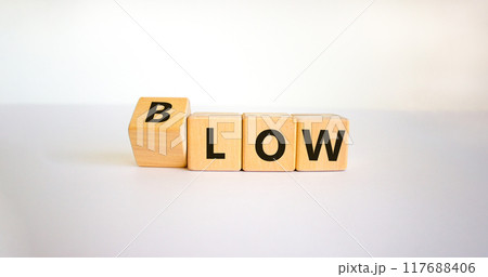 Low blow symbol. Turned a cube and changed the word 'low' to 'blow'. Beautiful white background, copy space. Business and low blow concept. 117688406