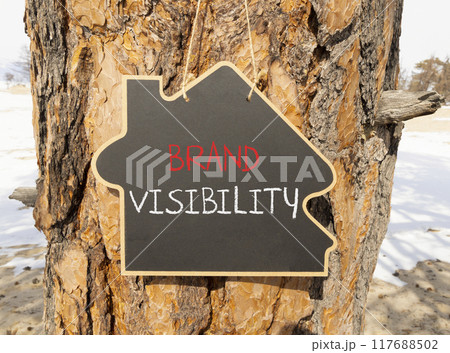 Brand visibility symbol. Concept words Brand visibility on beautiful black house blackboard. Beautiful tree background. Business branding and brand visibility concept. Copy space. 117688502