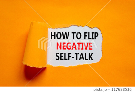 Flip negative self-talk symbol. Concept words How to flip negative self-talk on white paper on a beautiful orange background. Psychological and flip negative self-talk concept. Copy space. 117688536