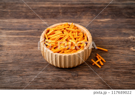 Cracker sticks on wooden background stock photo. 117689022