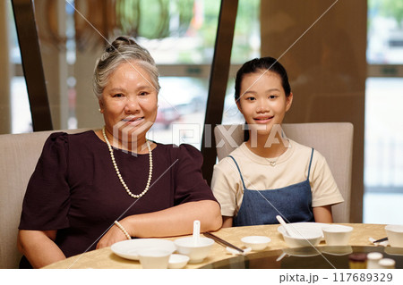 Girl Visiting Restaurant with Her Grandmother Girl Visiting Restaurant with Her Grandmother 117689329